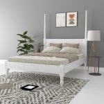 Eros Solid Wood Poster Bed showcasing intricate headboard and footboard fretwork in a warm honey finish.