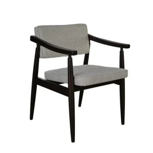 Elano Armchair in soft olive green velvet with sculpted arms and tapered legs in a modern living room