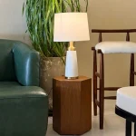 Linea Table with sleek wooden top and black metal legs in a minimalist dining room