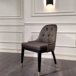 CloudSit Chair in misty grey velvet with plush cushions and rounded silhouette in a modern living room