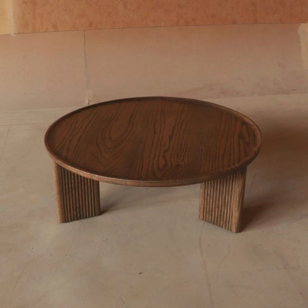 Modo Coffee Table with a wooden top and black metal legs in a minimalist living room setting