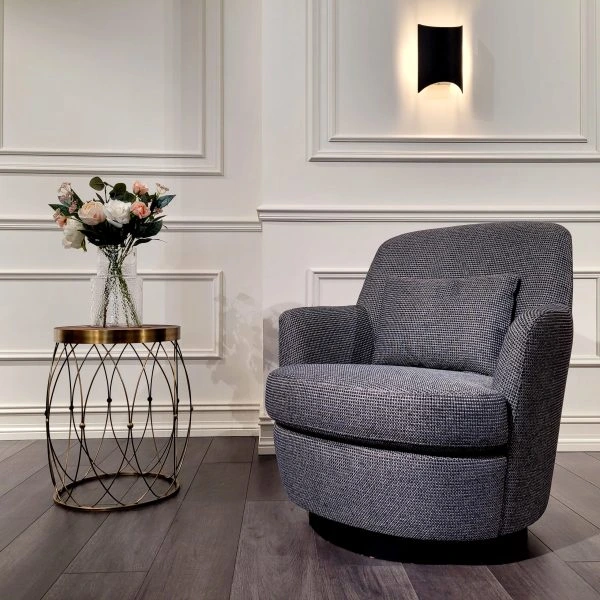 Majesta Arm Chair with velvet upholstery, high back, and curved arms in an elegant living room setting