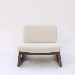 Royce Chair with velvet upholstery and tapered wooden legs in a modern living room