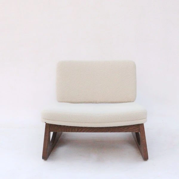 Royce Chair with velvet upholstery and tapered wooden legs in a modern living room