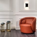 SnugNest Arm Chair in boucle fabric with a curved back and plush seat in a cozy reading corner