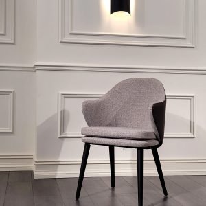 Monarch Chair in emerald velvet with high back and sculpted arms in a luxurious living room