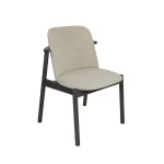 Vivre Dining Chair with curved upholstered back and wooden legs in a modern dining room setting