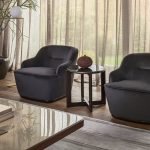 Fez Armchair with sleek design, upholstered in fabric, and featuring a solid beechwood base.