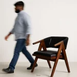 WoodMuse Chair crafted from solid Sheesham wood with a sculpted backrest and cushioned seat — ideal for artistic, modern, or cozy spaces.