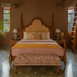 Classic solid wood poster bed in Sheesham wood with low platform base and seamless headboard design