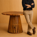 “Monarch sculpted base solid wood round dining table with handcrafted pedestal design.”