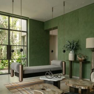 Modern indoor hanging swing with cushioned seat and metal supports in a luxury living space