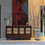 Varen Cane Sideboard with dark walnut-tone wooden frame, four natural cane-panelled cabinet doors, two storage drawers, and tapered wooden legs.