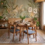 Elio six-seater dining set with natural wood-tone rectangular table, rounded corners, tapered legs, and six wooden chairs with blue-grey upholstered seats.