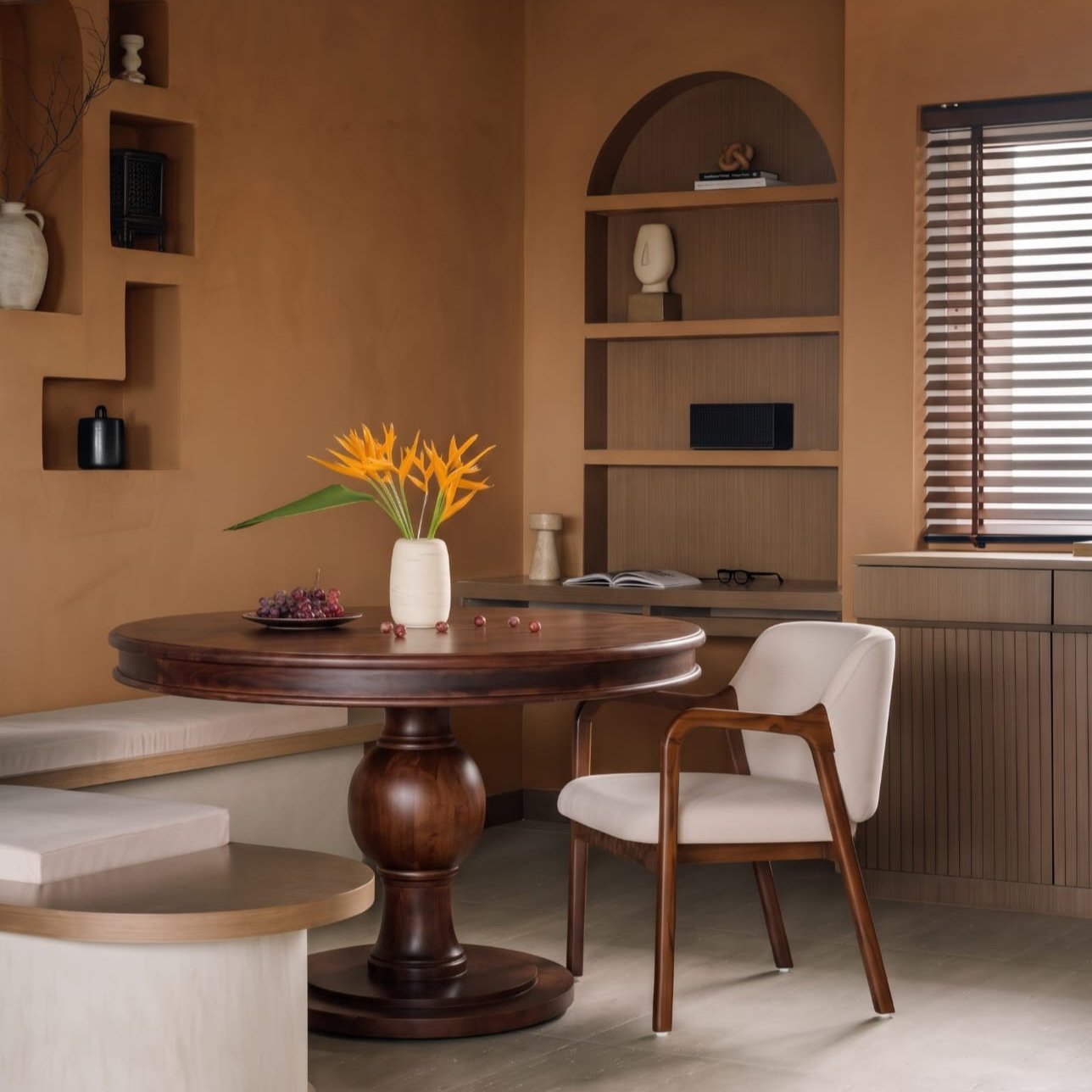 Avira round wooden dining table with pedestal base and rich wood finish, size 120 × 120 × 78 cm.