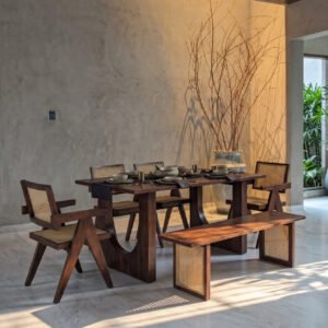 Axton Dining Set featuring a dark walnut-tone rectangular wooden dining table, four cane dining chairs, and matching wooden bench with cane-panelled supports.